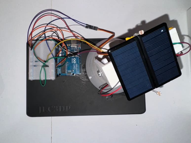Top view of the assembled Solar Tracker showing both LDR sensors, the central barrier, panel, Arduino, and breadboard